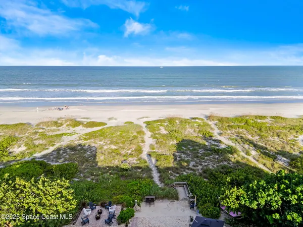 a view of swimming pool with an outdoor seating
