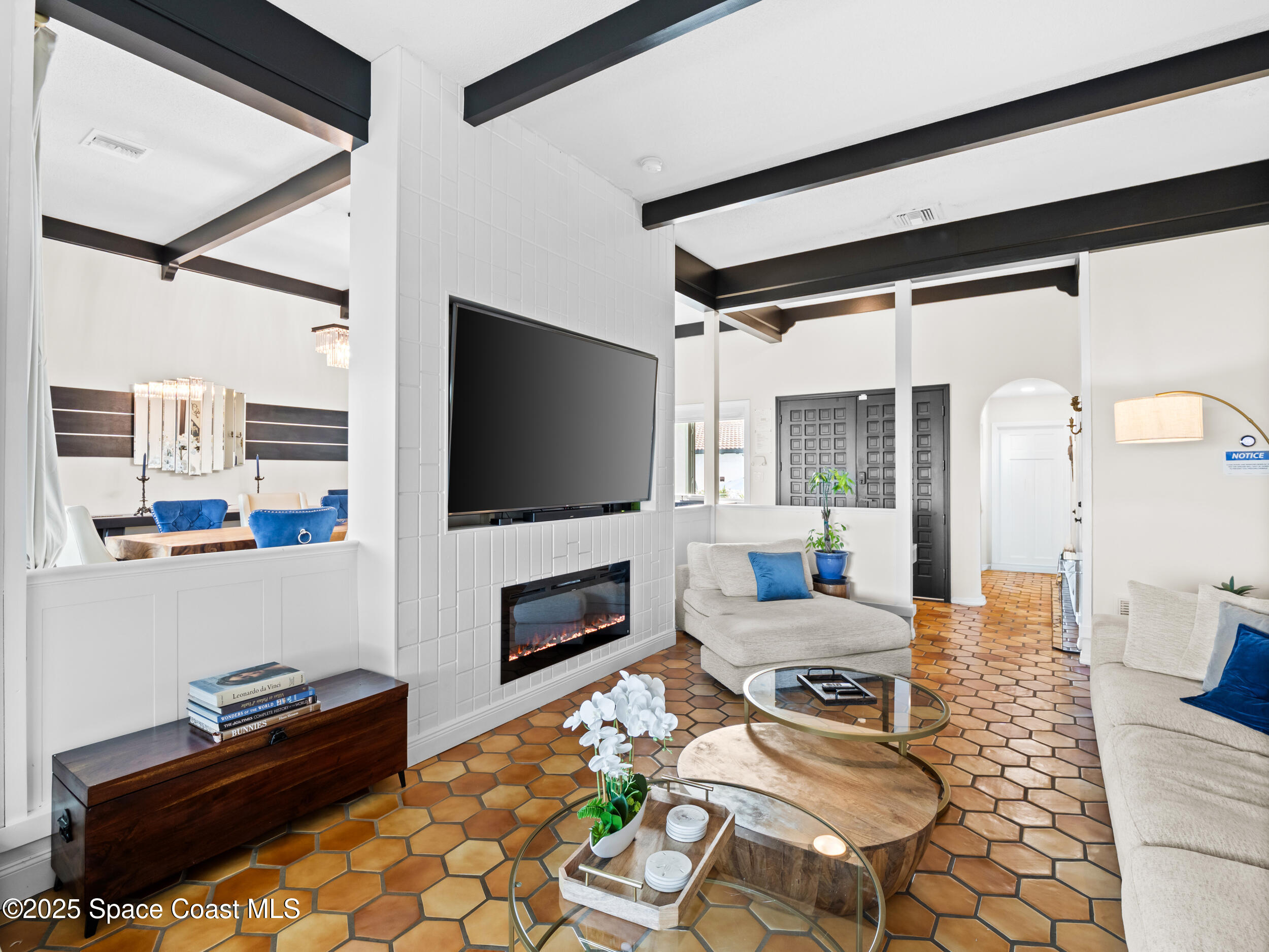 933 South Atlantic Avenue Cocoa Beach, FL 32931 - Photo 31 of 46 a living room with furniture and a flat screen tv