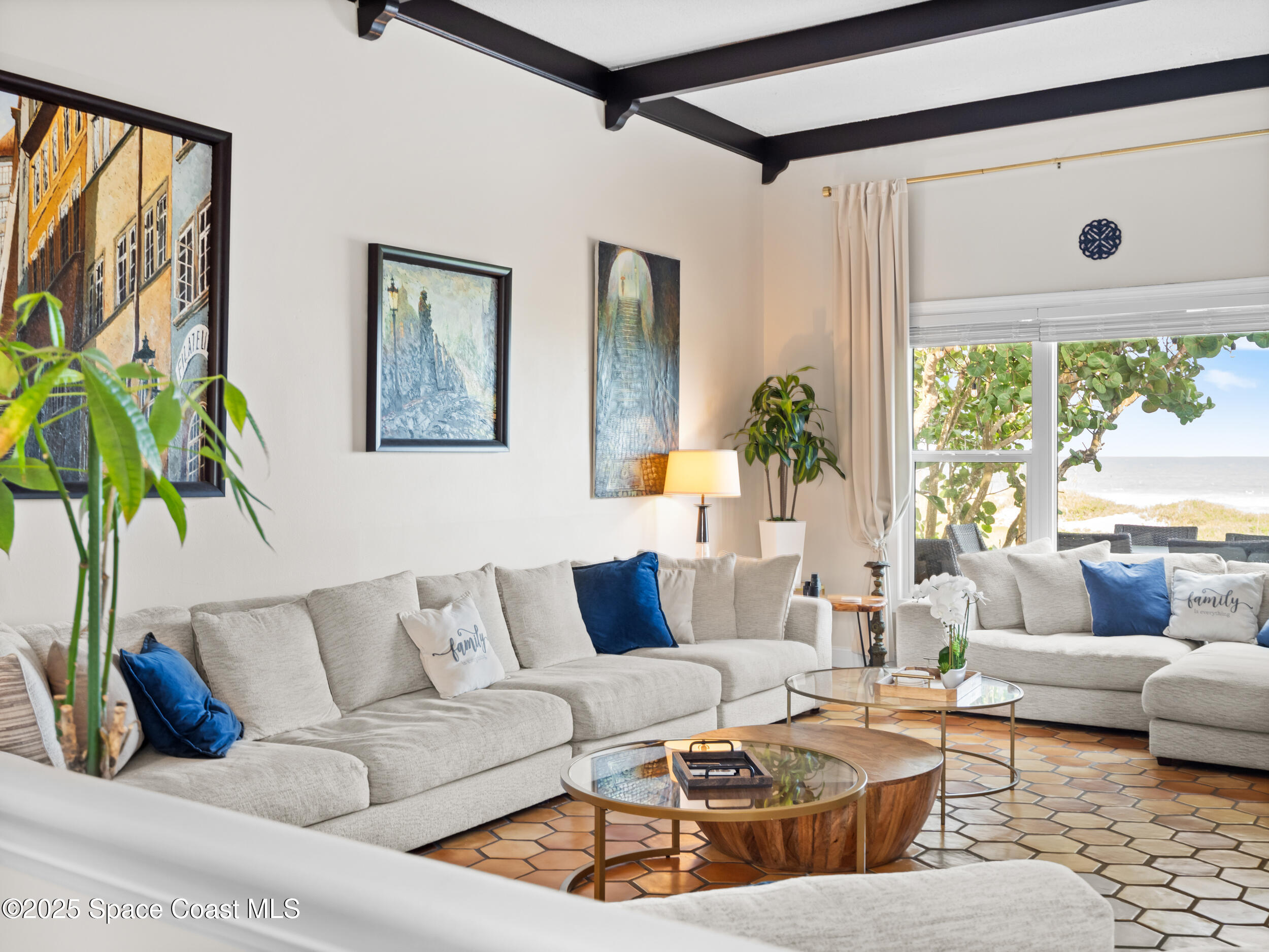 933 South Atlantic Avenue Cocoa Beach, FL 32931 - Photo 34 of 46 a living room with furniture and a large window