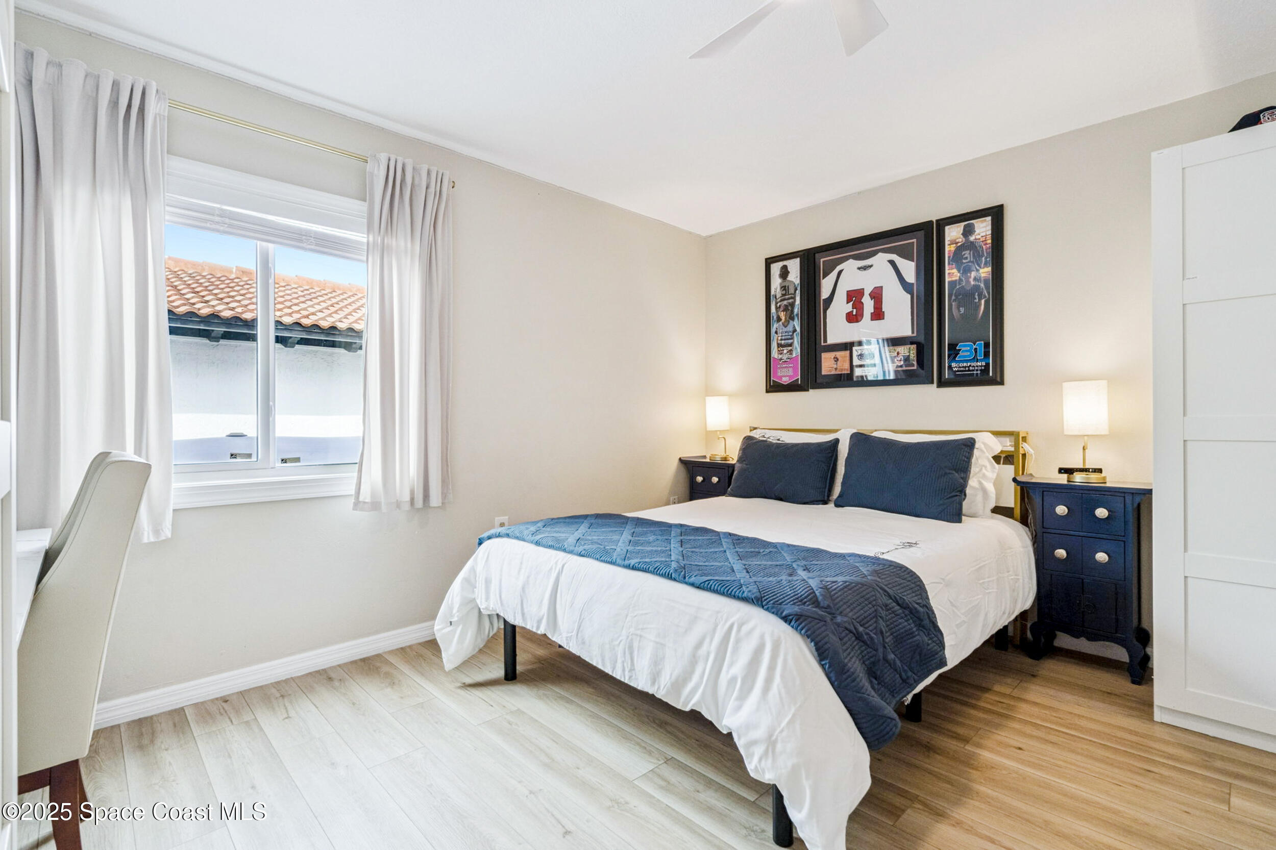 933 South Atlantic Avenue Cocoa Beach, FL 32931 - Photo 36 of 46 a bedroom with a bed and a window