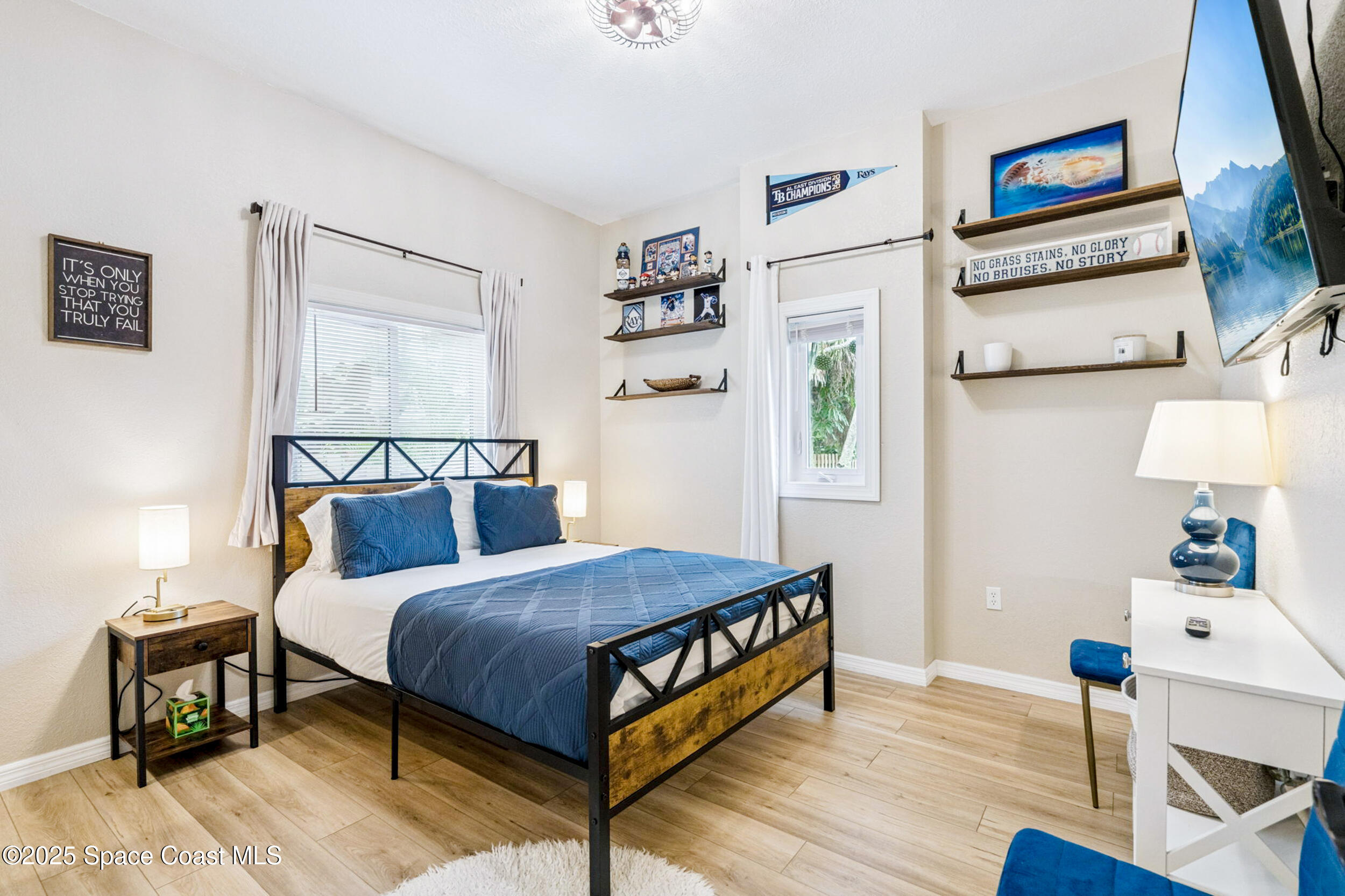 933 South Atlantic Avenue Cocoa Beach, FL 32931 - Photo 40 of 46 a bedroom with a bed and a table in it