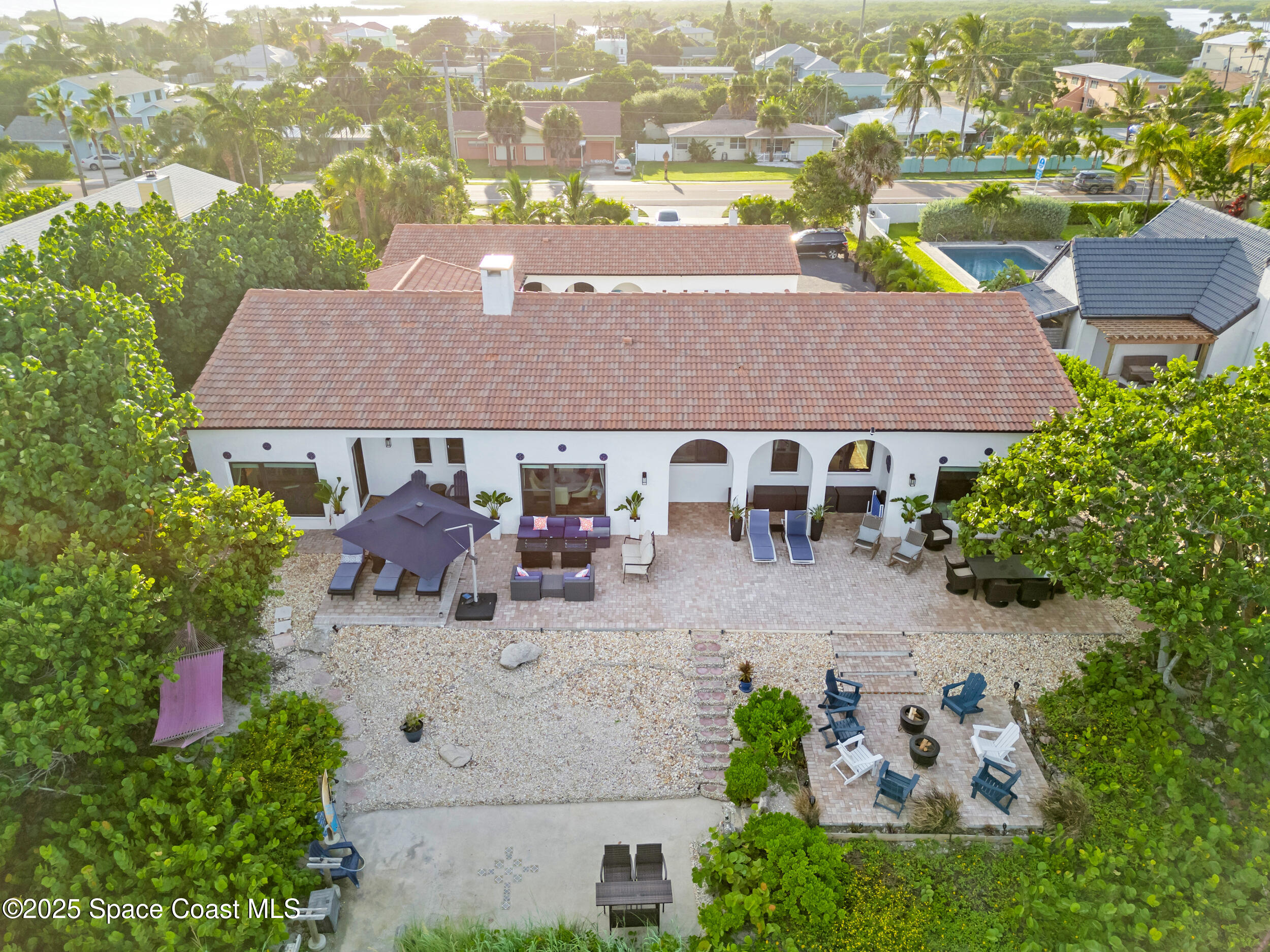933 South Atlantic Avenue Cocoa Beach, FL 32931 - Photo 5 of 46 an aerial view of a house with garden space and lake view