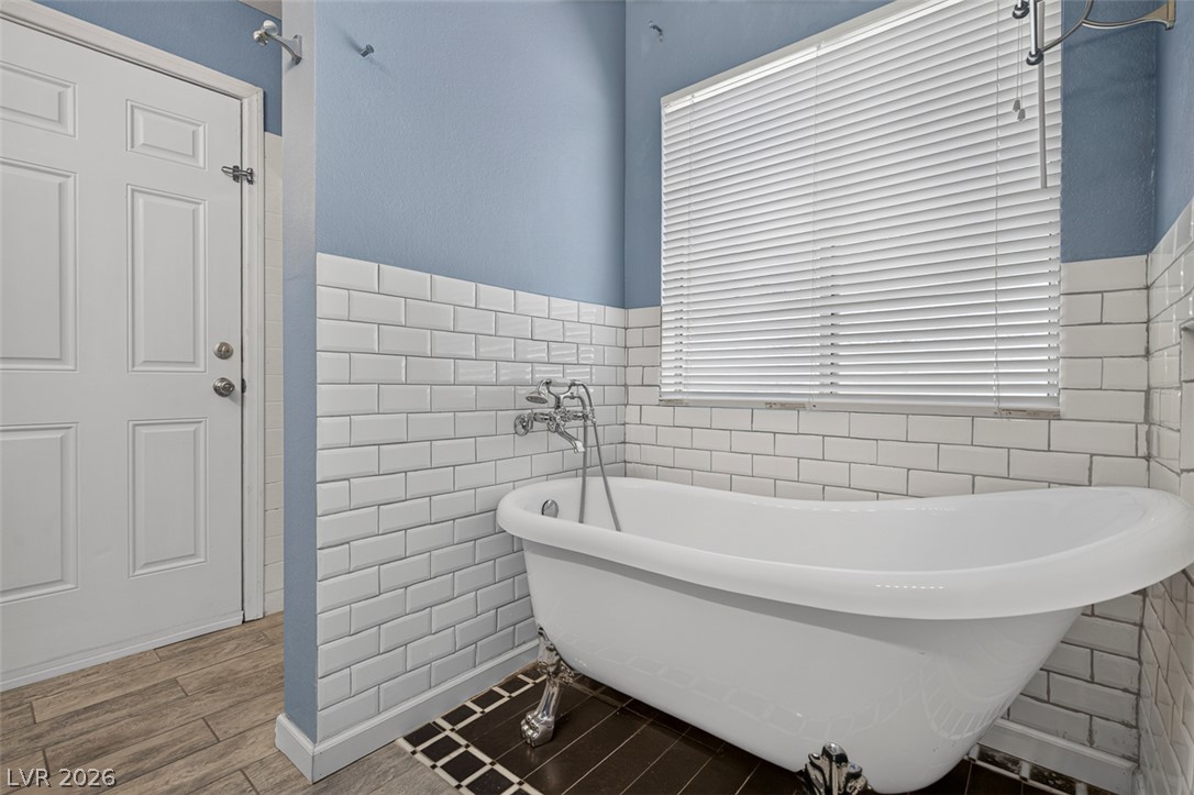 2609 Shakespeare Road Las Vegas, NV 89108 - Photo 21 of 41 Indulge in relaxation with this elegant clawfoot tub, ideal for unwinding after a long day.