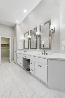 a bathroom with a tub and shower