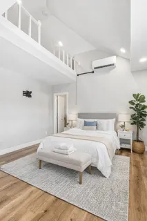 an aerial view of a house with outdoor space and lake view