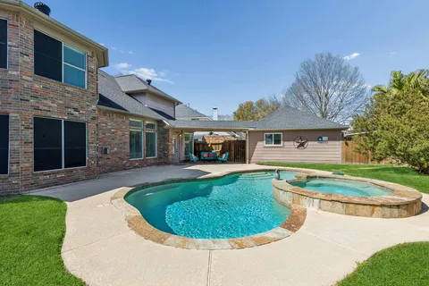 a view of a house with a swimming pool