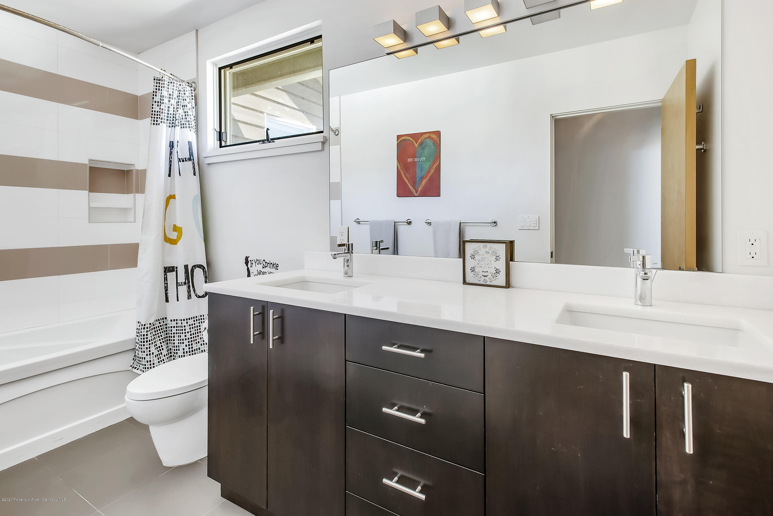 80 Riverdown Drive Aspen, CO 81611 - Photo 20 of 31 a bathroom with a sink a toilet and shower