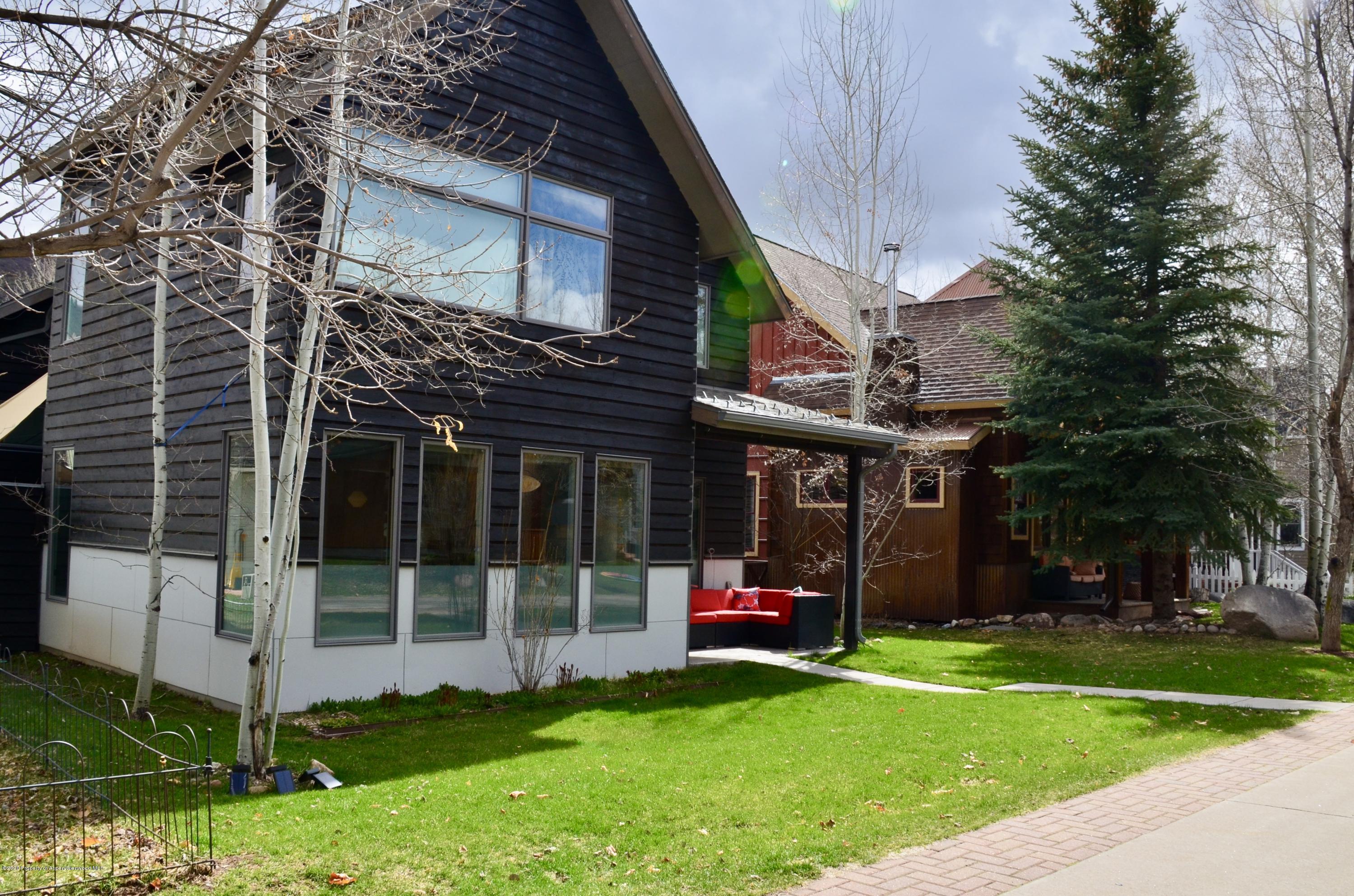 80 Riverdown Drive Aspen, CO 81611 - Photo 23 of 31 a view of a house with a yard and sitting area