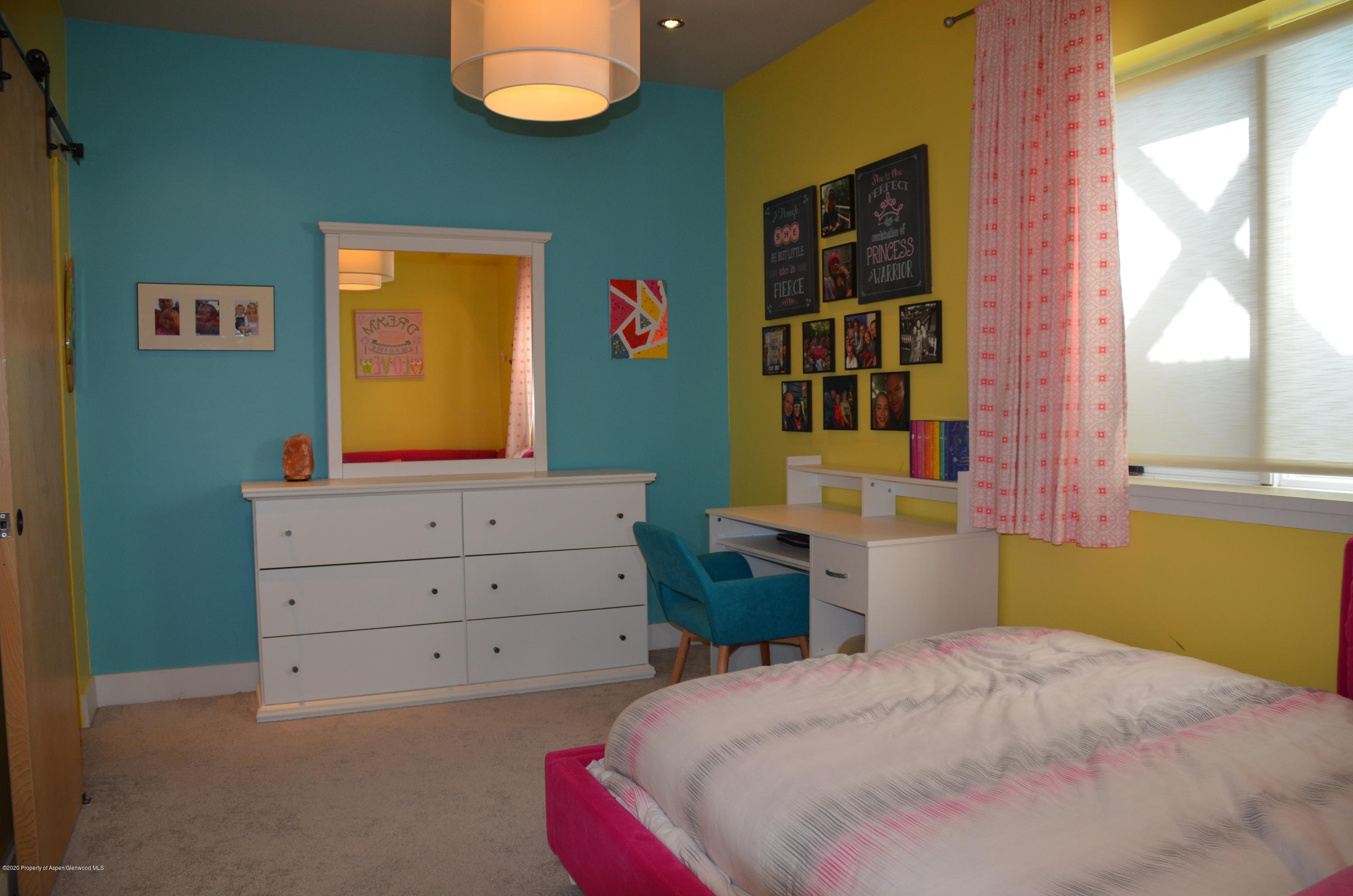 80 Riverdown Drive Aspen, CO 81611 - Photo 25 of 31 a bedroom with a bed and a dresser