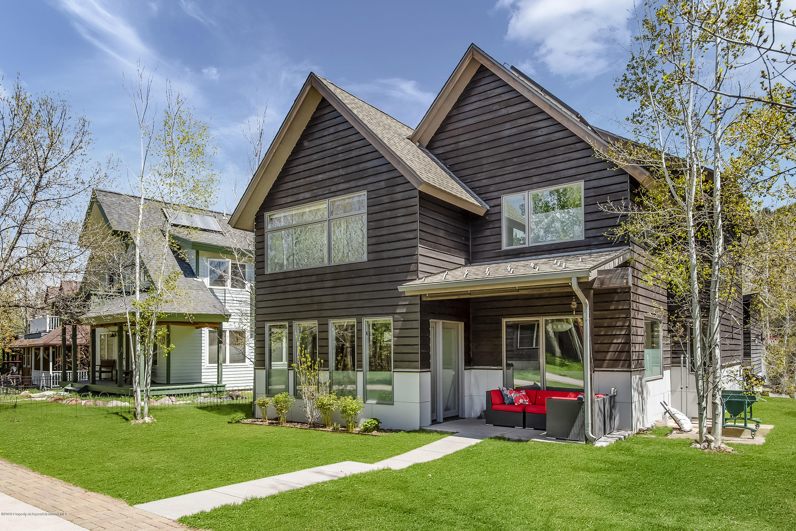 80 Riverdown Drive Aspen, CO 81611 - Photo 29 of 31 a front view of a house with a yard and garden