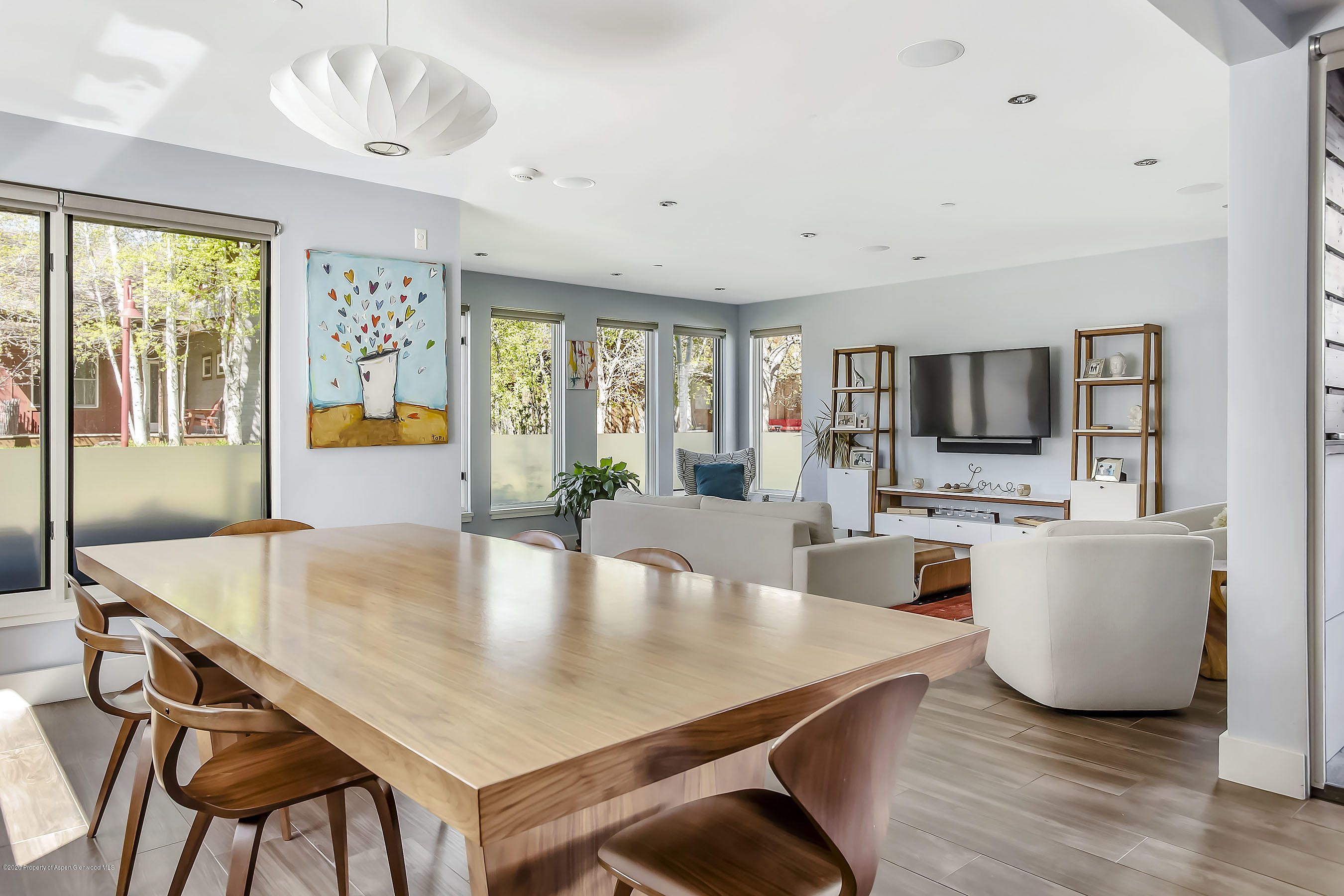 80 Riverdown Drive Aspen, CO 81611 - Photo 5 of 31 a large dining space with furniture window and wooden floor