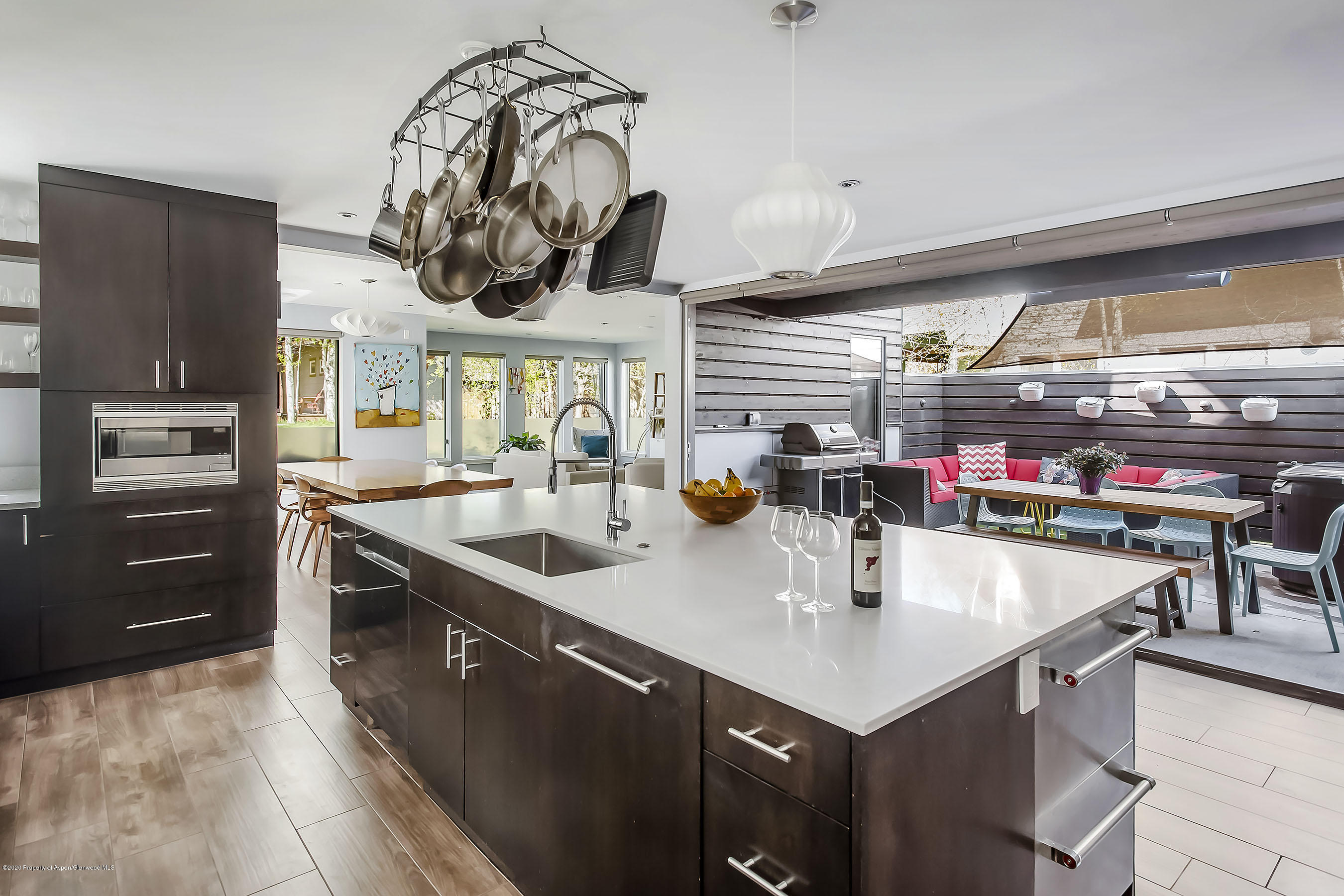 80 Riverdown Drive Aspen, CO 81611 - Photo 7 of 31 a kitchen with a sink a stove and chairs
