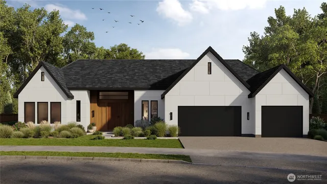 a front view of house with garage and green space