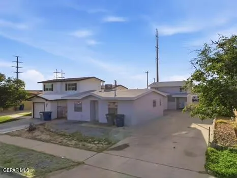 a view of a big house with a street