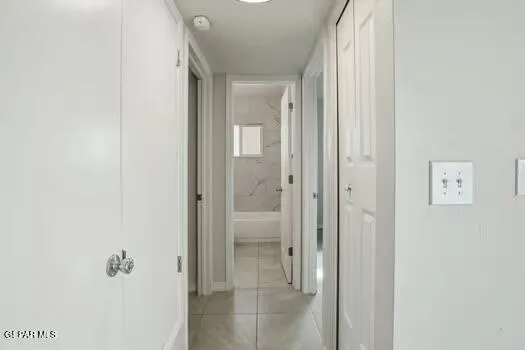 a bathroom with a glass shower door
