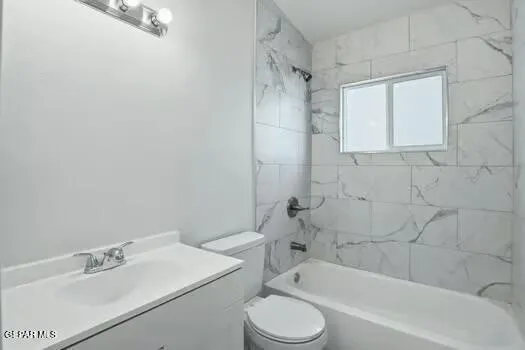 a bathroom with a sink toilet and bathtub