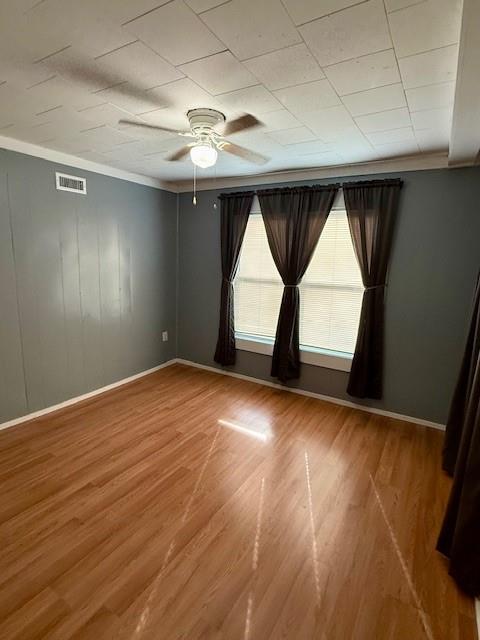 106 Mac Avenue Calhoun, GA 30701 - Photo 14 of 16 an empty room with wooden floor and windows