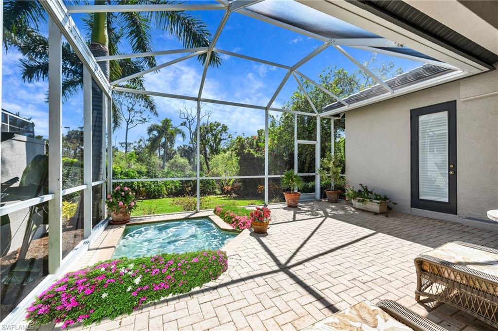 Located in the rear of the home a nice covered area along with your personal spa to relax and enjoy the peaceful preserve