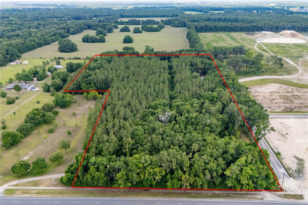 23227 West Newberry Road Newberry, FL 32669 - Photo 4 of 30 an aerial view of a house with a yard and lake view
