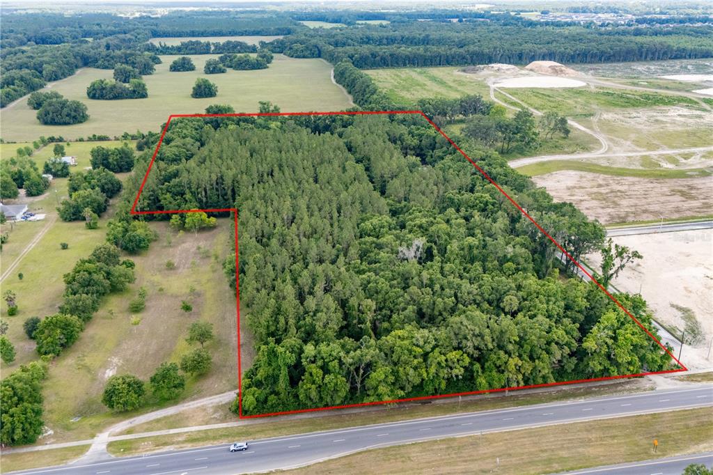 23227 West Newberry Road Newberry, FL 32669 - Photo 6 of 30 an aerial view of ocean with residential house with outdoor space and trees around