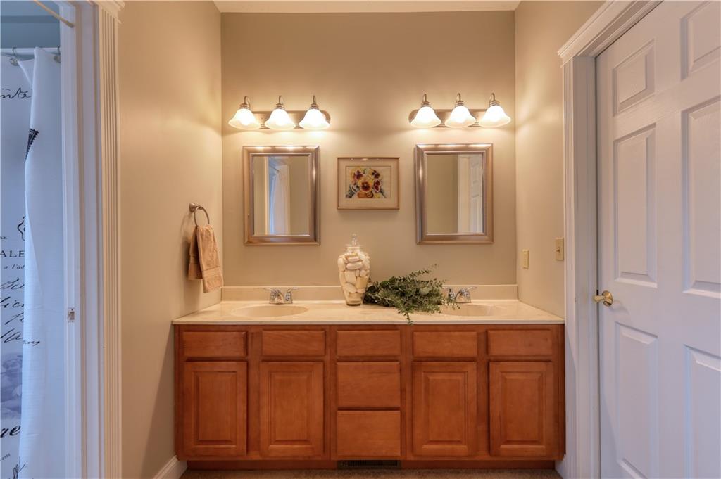 668 Riverside Drive Beaver, PA 15009 - Photo 19 of 25 The convenience of double sinks...door on the right is your large walk-in closet. To the left, is your private bath area.