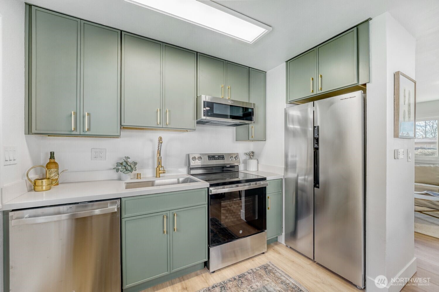 98056-768 Dayton Avenue Northeast Renton, WA 98056 - Photo 11 of 27 a kitchen with stainless steel appliances granite countertop a refrigerator a stove a sink and dishwasher