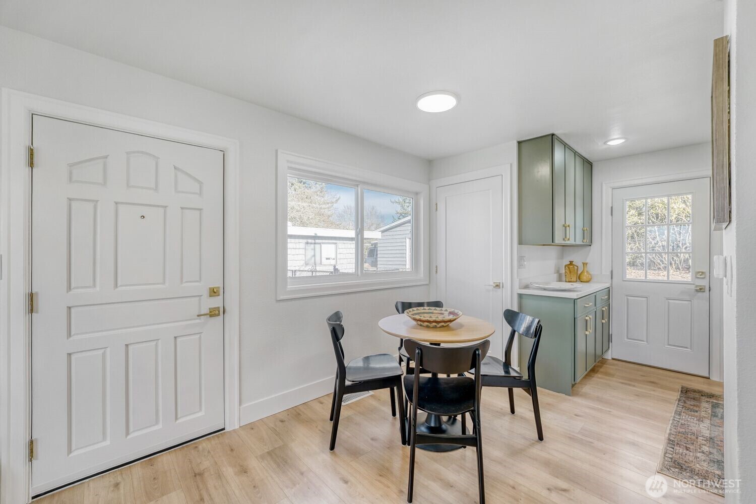 98056-768 Dayton Avenue Northeast Renton, WA 98056 - Photo 15 of 27 a view of a dining room with furniture and window