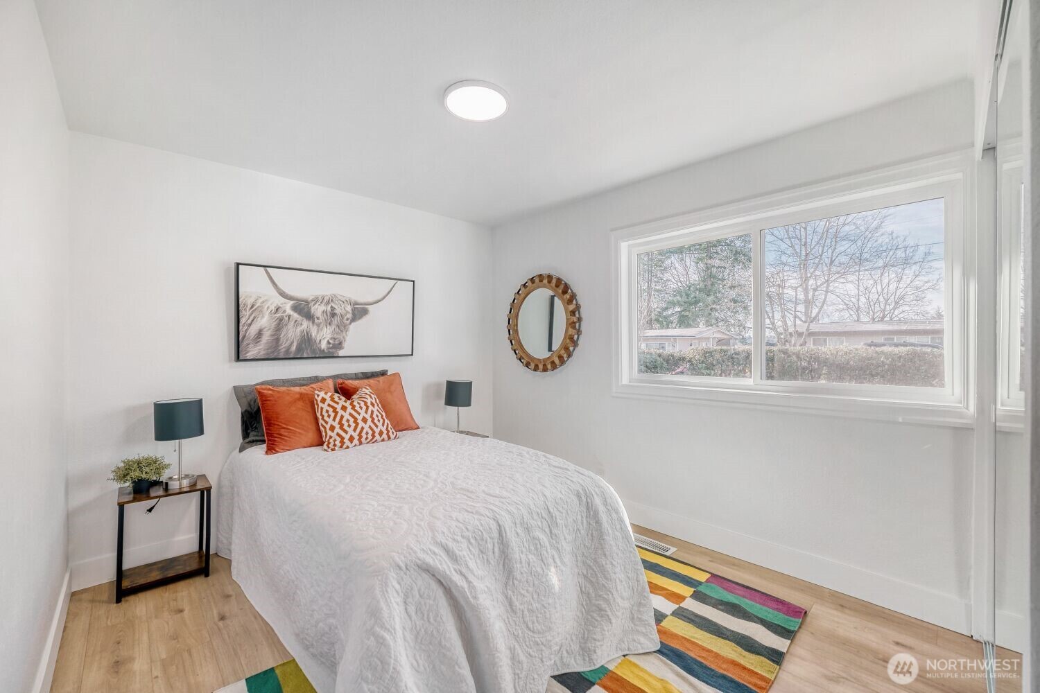 98056-768 Dayton Avenue Northeast Renton, WA 98056 - Photo 16 of 27 a bedroom with a bed and a window
