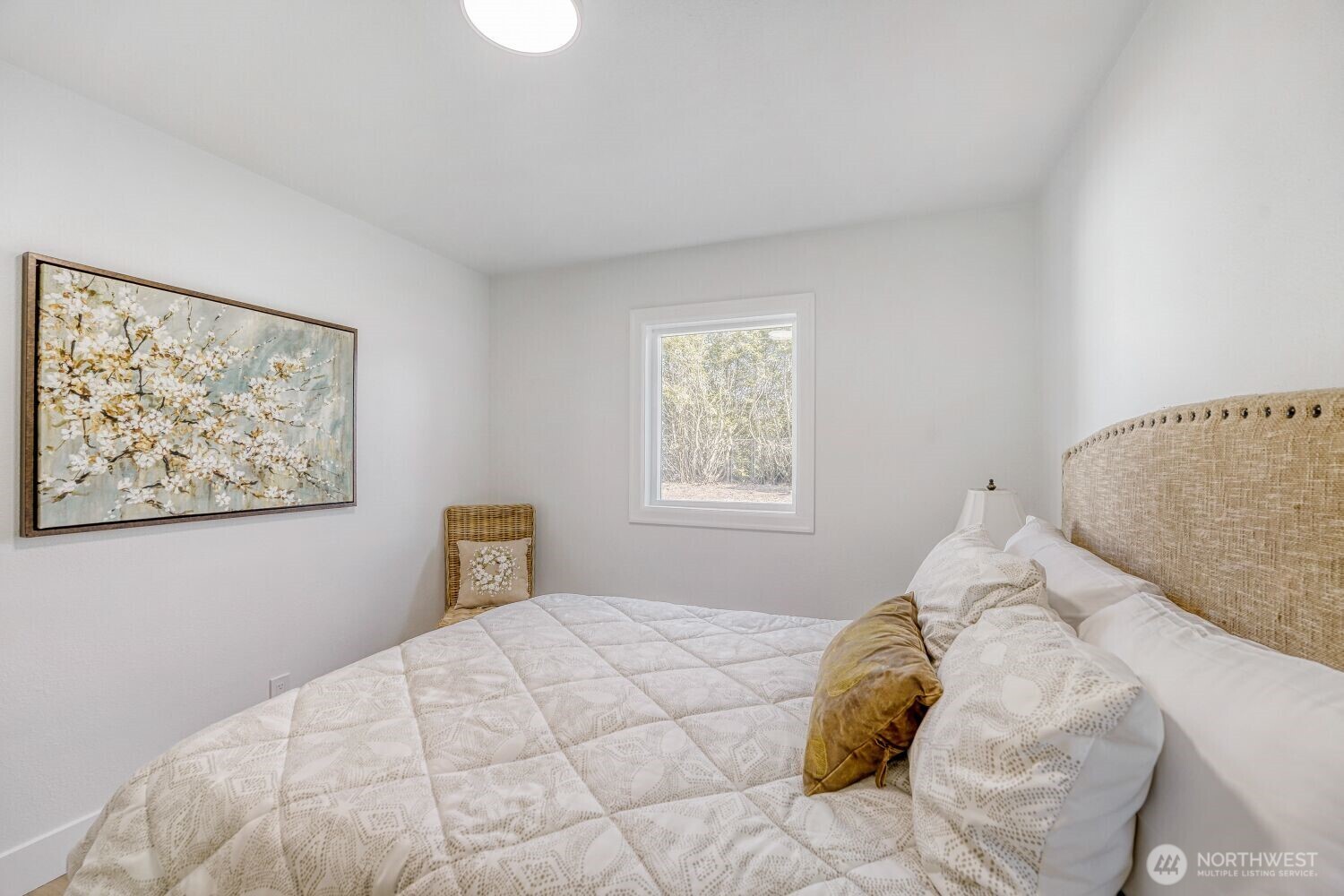 98056-768 Dayton Avenue Northeast Renton, WA 98056 - Photo 20 of 27 a bedroom with a large bed and a window