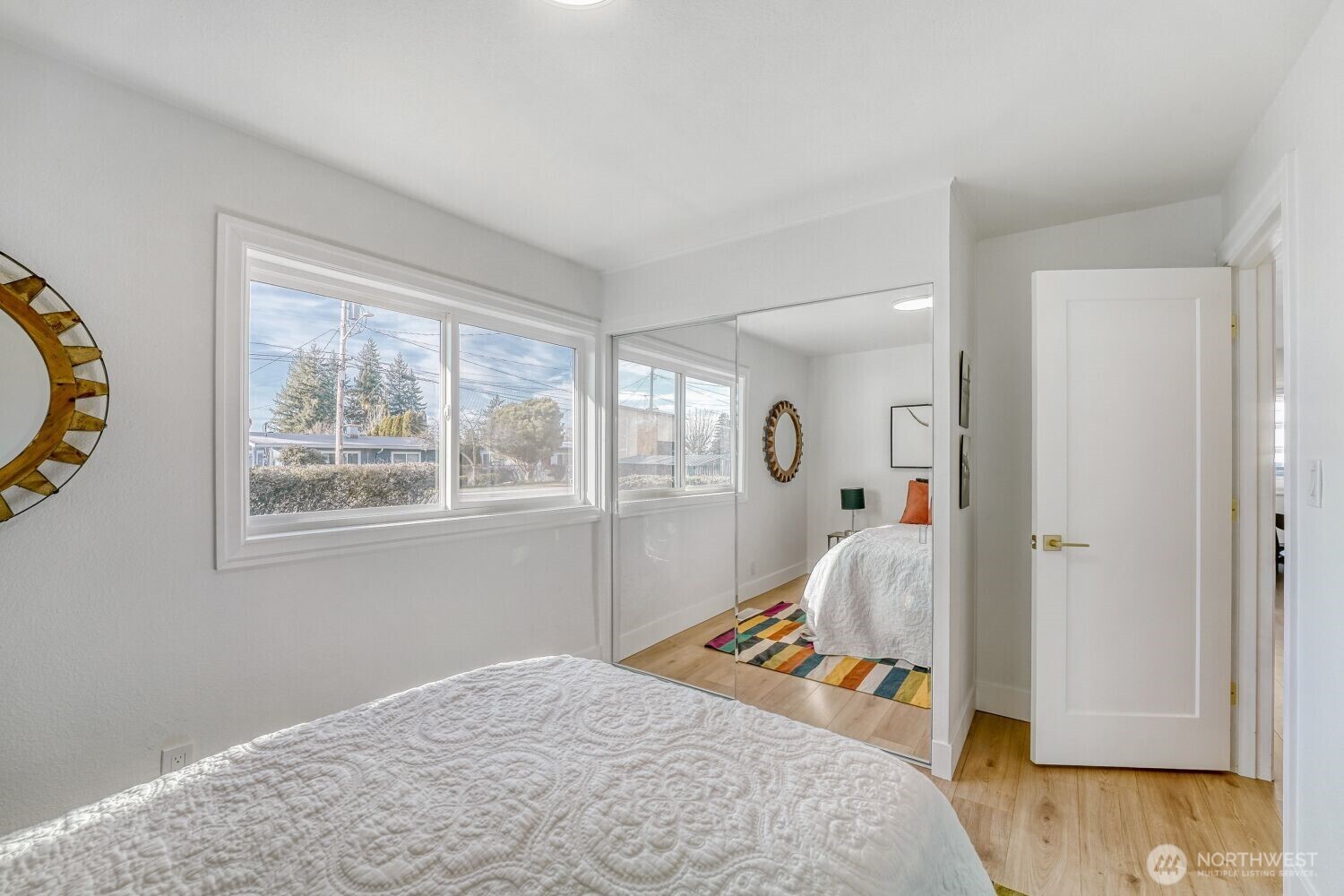 98056-768 Dayton Avenue Northeast Renton, WA 98056 - Photo 21 of 27 a bedroom with a bed and a window