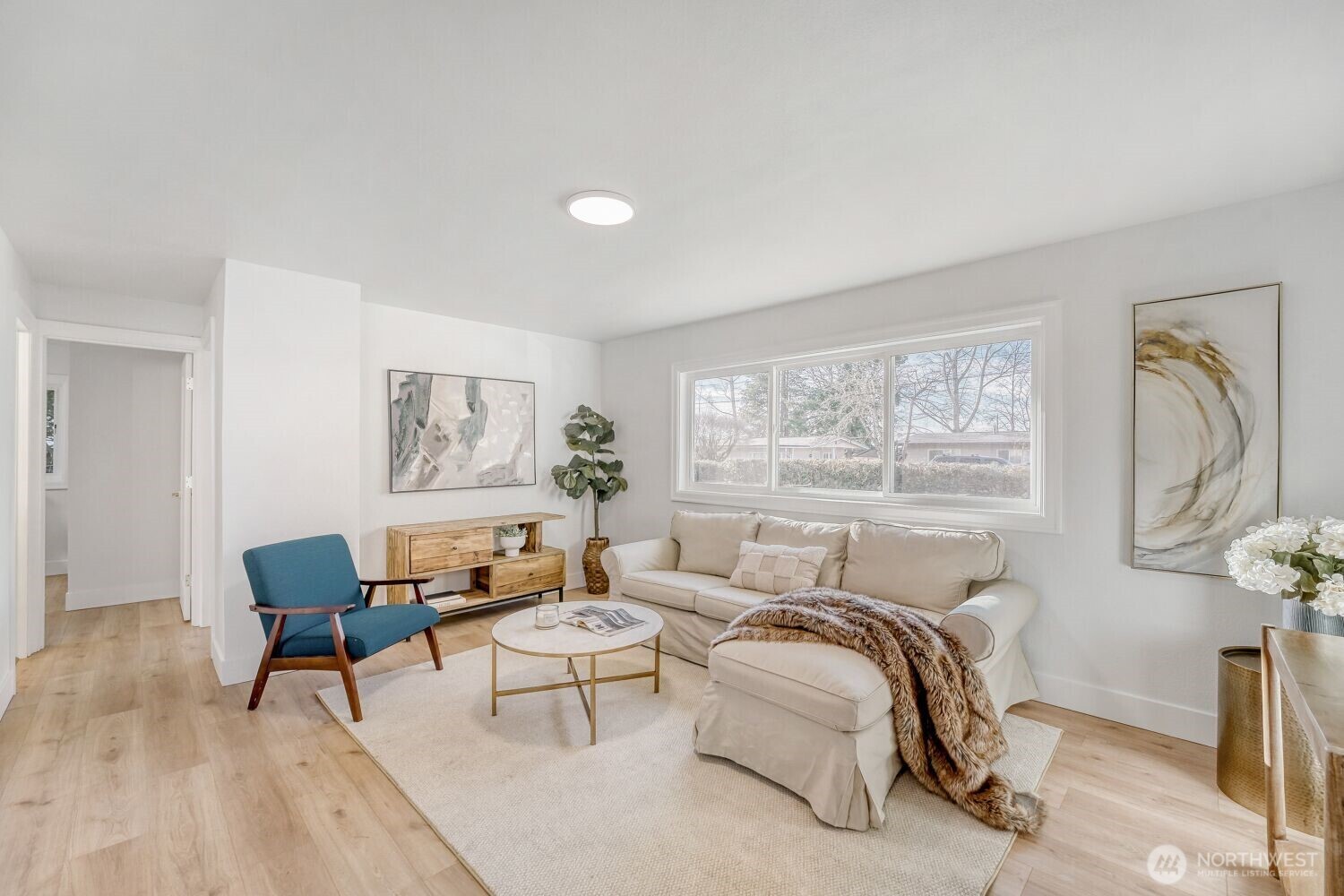 98056-768 Dayton Avenue Northeast Renton, WA 98056 - Photo 3 of 27 a bedroom with furniture and a window