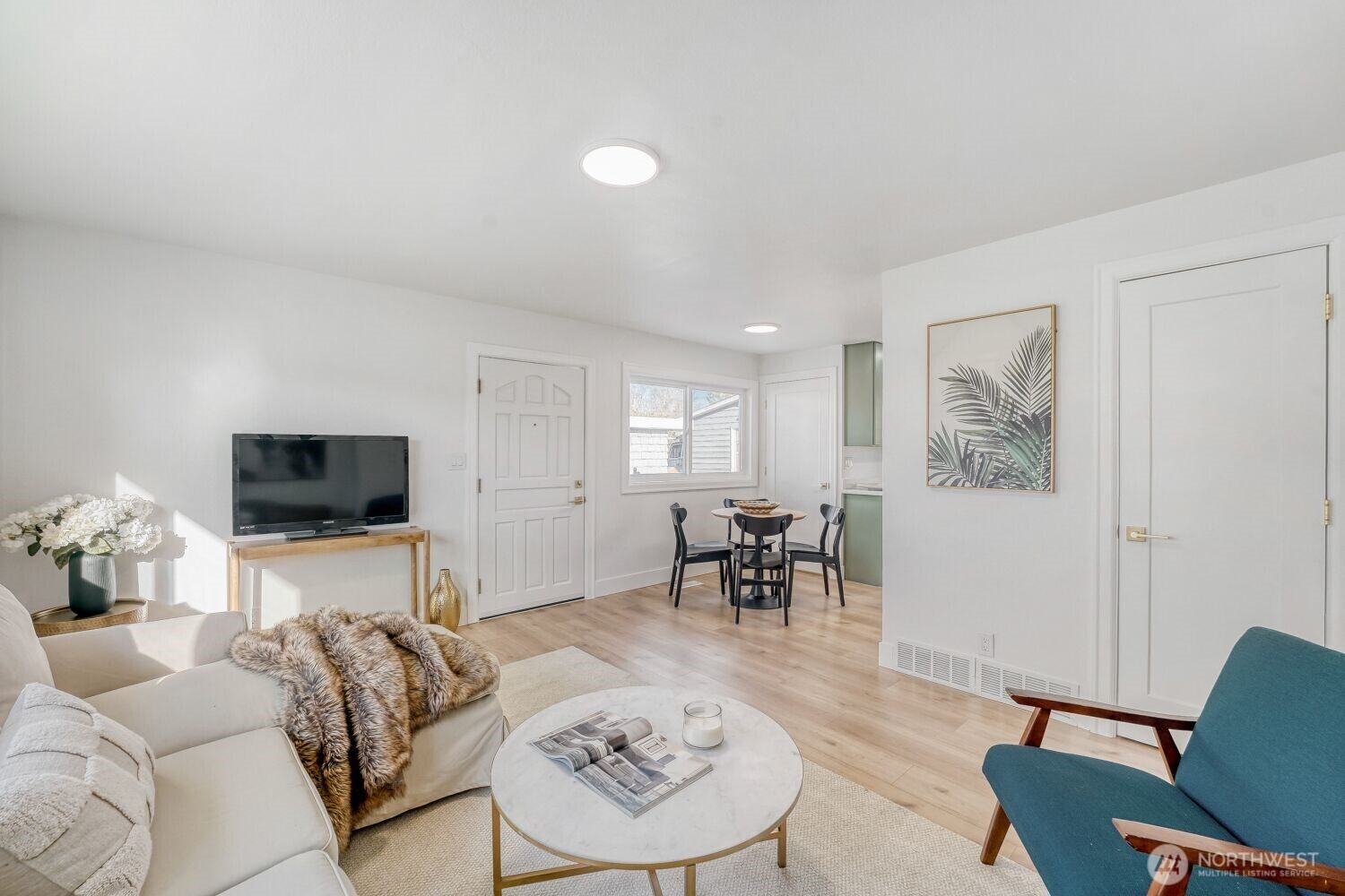 98056-768 Dayton Avenue Northeast Renton, WA 98056 - Photo 5 of 27 a living room with furniture and a flat screen tv