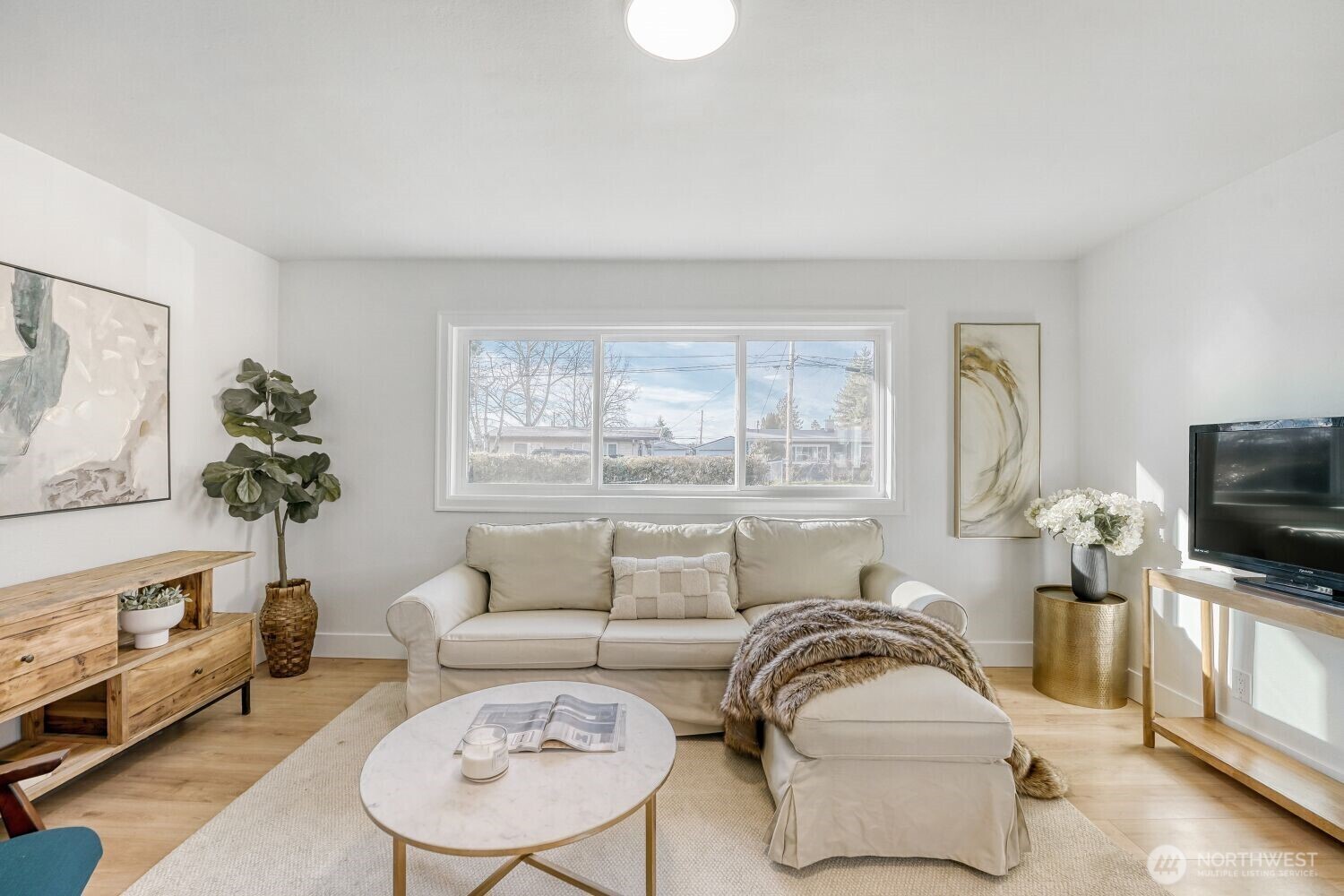 98056-768 Dayton Avenue Northeast Renton, WA 98056 - Photo 8 of 27 a living room with furniture and a flat screen tv