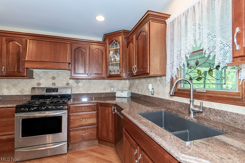30073 Ridge Road Wickliffe, OH 44092 - Photo 10 of 34 Kitchen with Granite Counters, recessed sink and Stainless Appliances