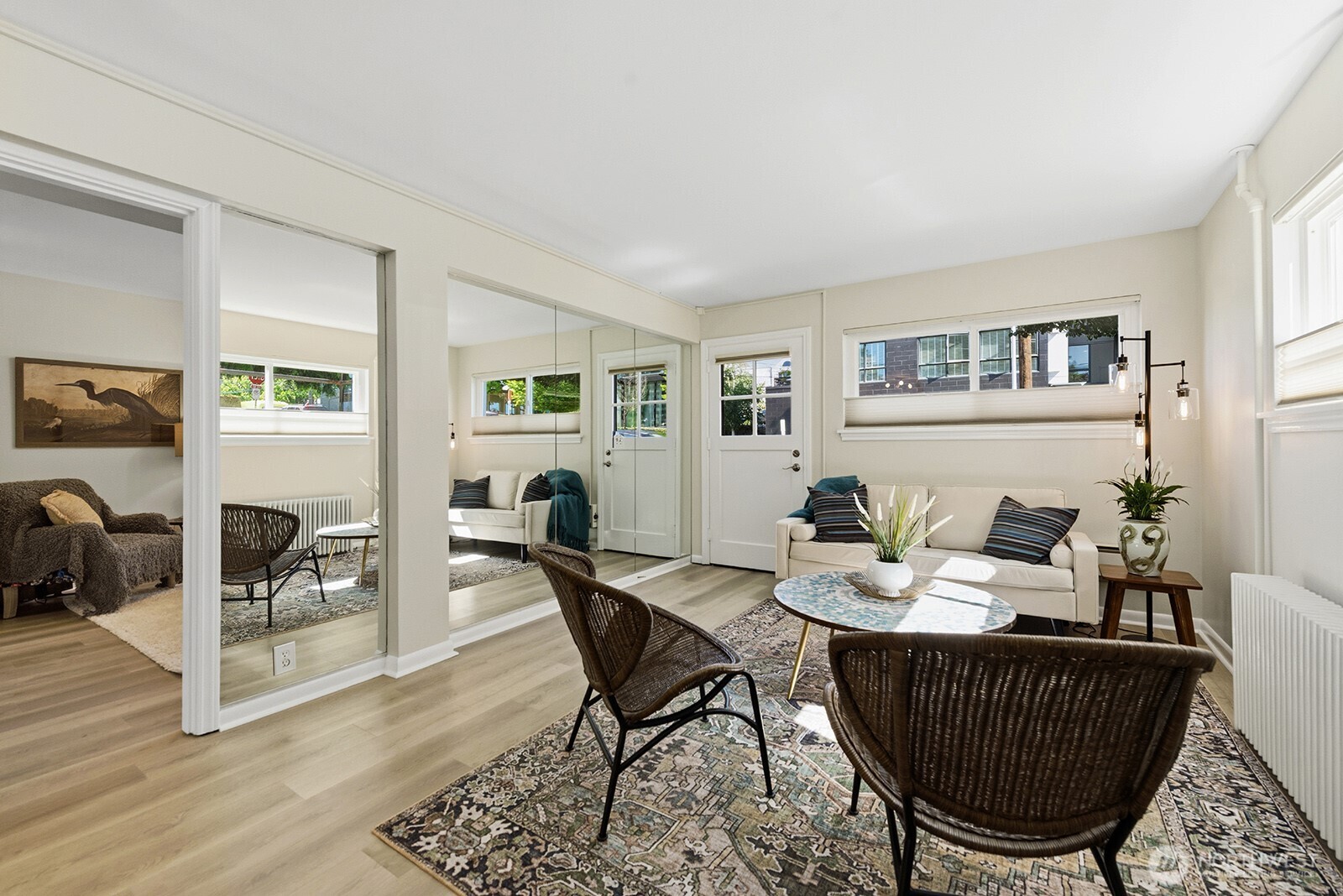 4407 Southwest Alaska Street, Unit 11 Seattle, WA 98116 - Photo 3 of 24 a dining room with furniture and wooden floor