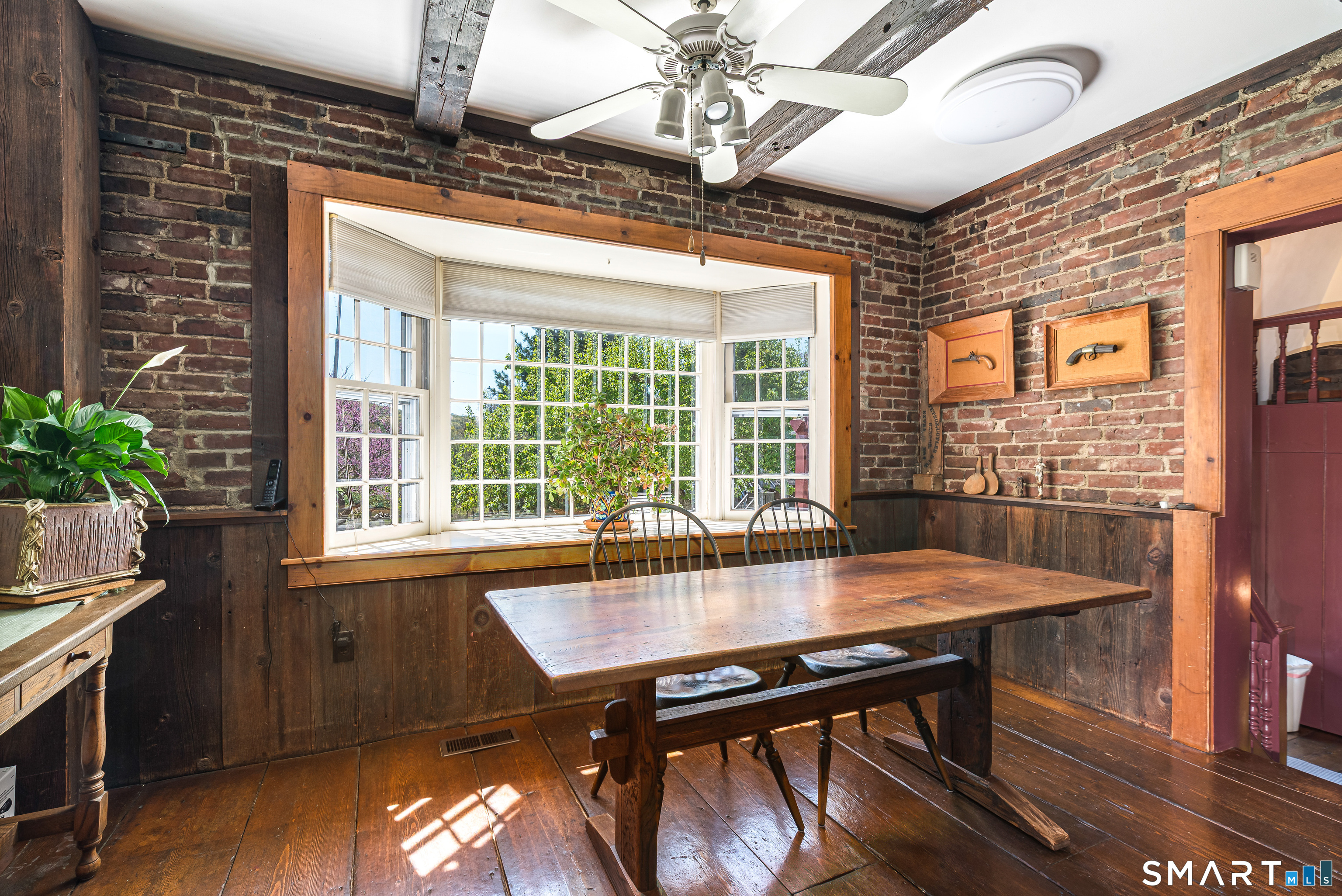 29 Spencer Road Haddam, CT 06441 - Photo 14 of 40 a view of a dining room with furniture window and wooden floor