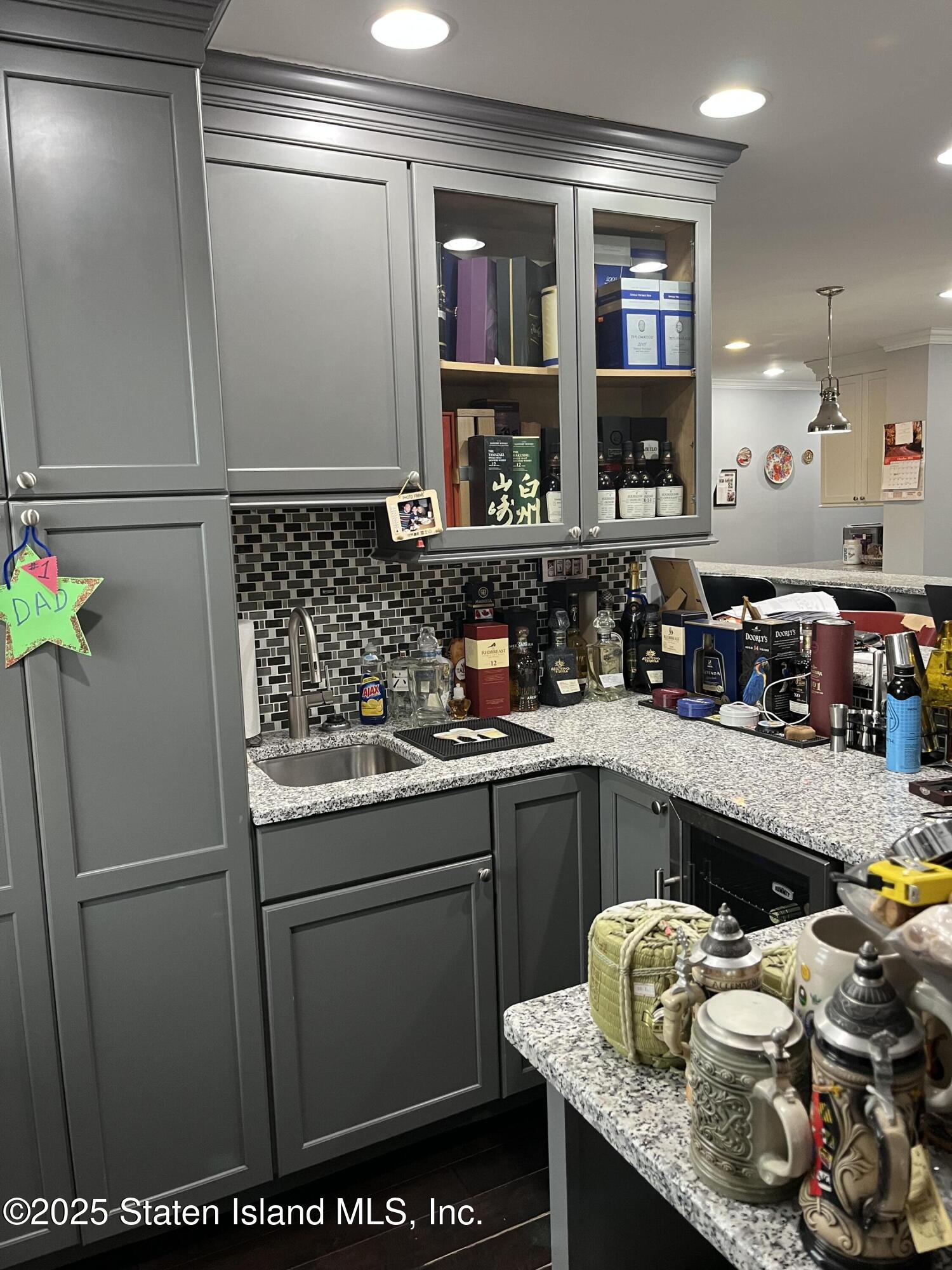 1000 Clove Road, Unit 6O & 6P Staten Island, NY 10301 - Photo 14 of 45 a kitchen with stainless steel appliances granite countertop a refrigerator and a stove top oven