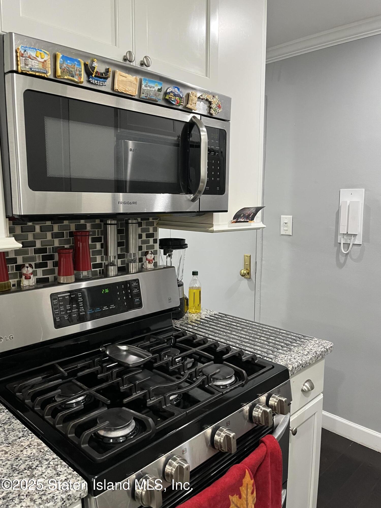 1000 Clove Road, Unit 6O & 6P Staten Island, NY 10301 - Photo 17 of 45 a stove top oven sitting inside of a kitchen