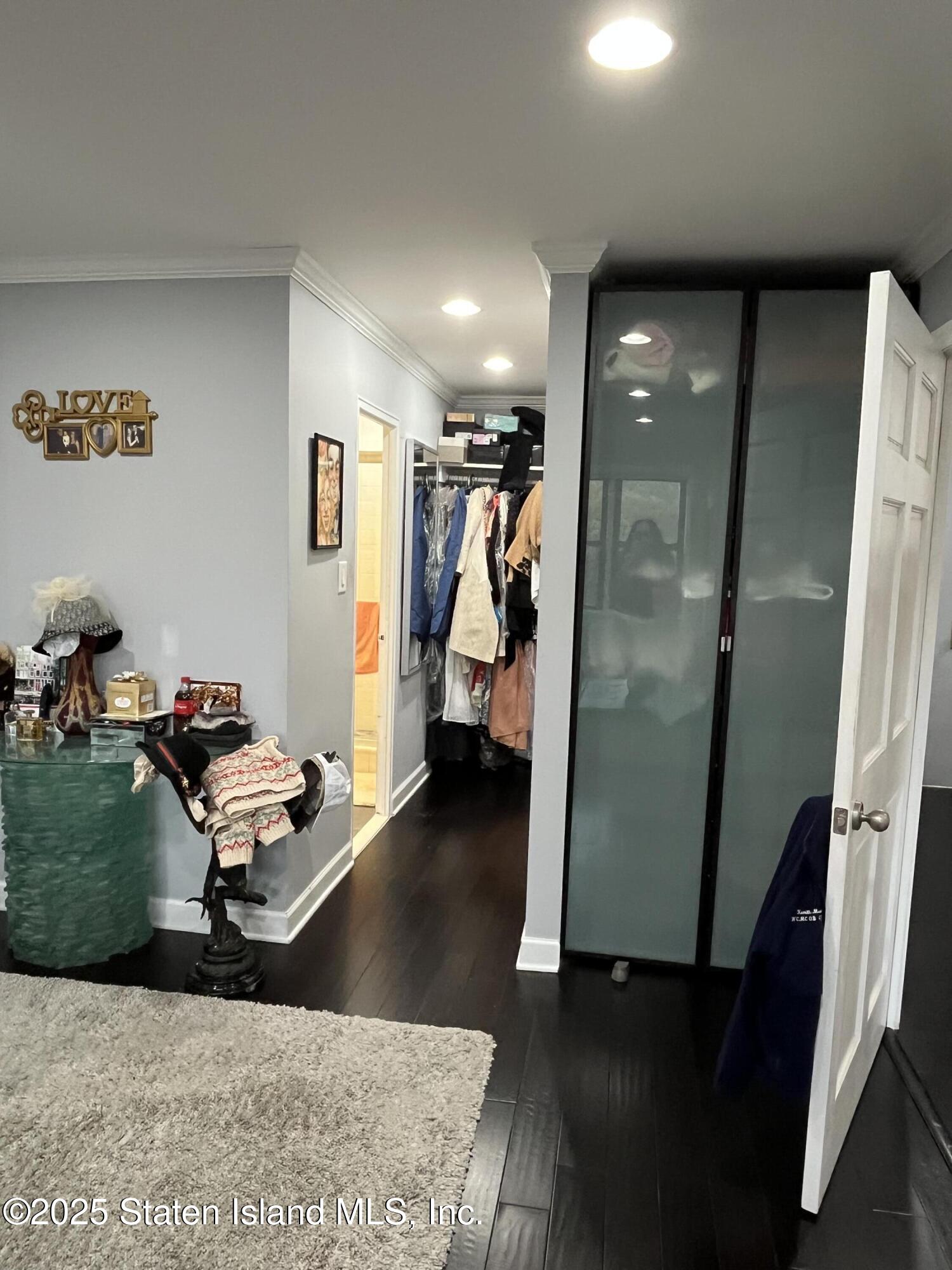 1000 Clove Road, Unit 6O & 6P Staten Island, NY 10301 - Photo 22 of 45 a room with furniture and a wooden floor