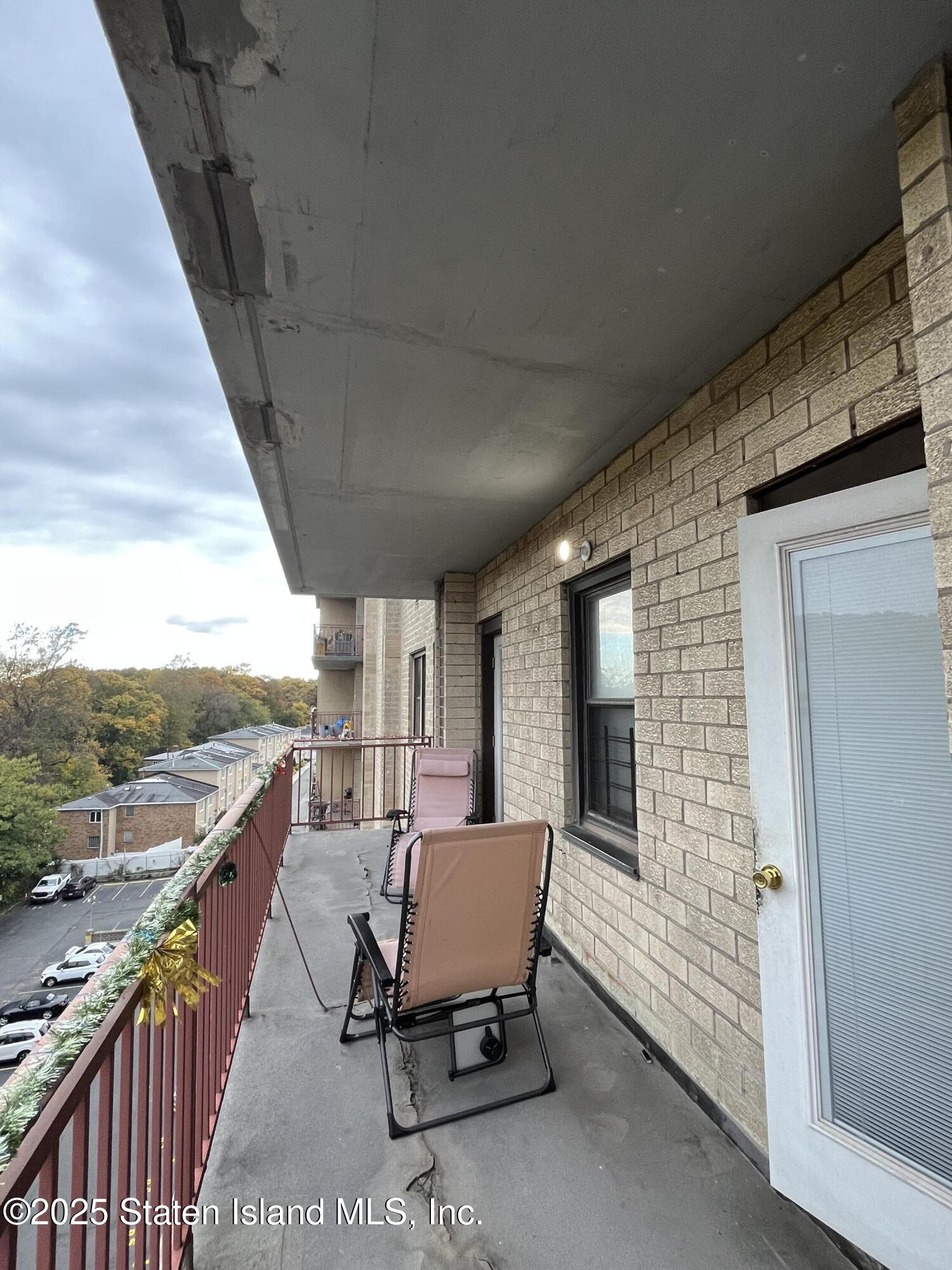 1000 Clove Road, Unit 6O & 6P Staten Island, NY 10301 - Photo 28 of 45 a view of a balcony with furniture and outside view