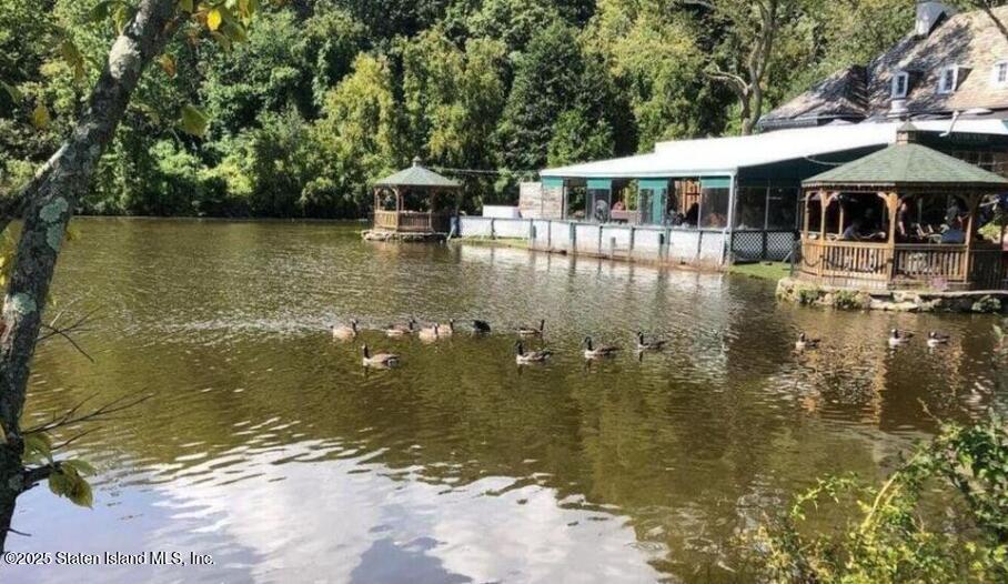 1000 Clove Road, Unit 6O & 6P Staten Island, NY 10301 - Photo 42 of 45 a view of a swimming pool with a patio