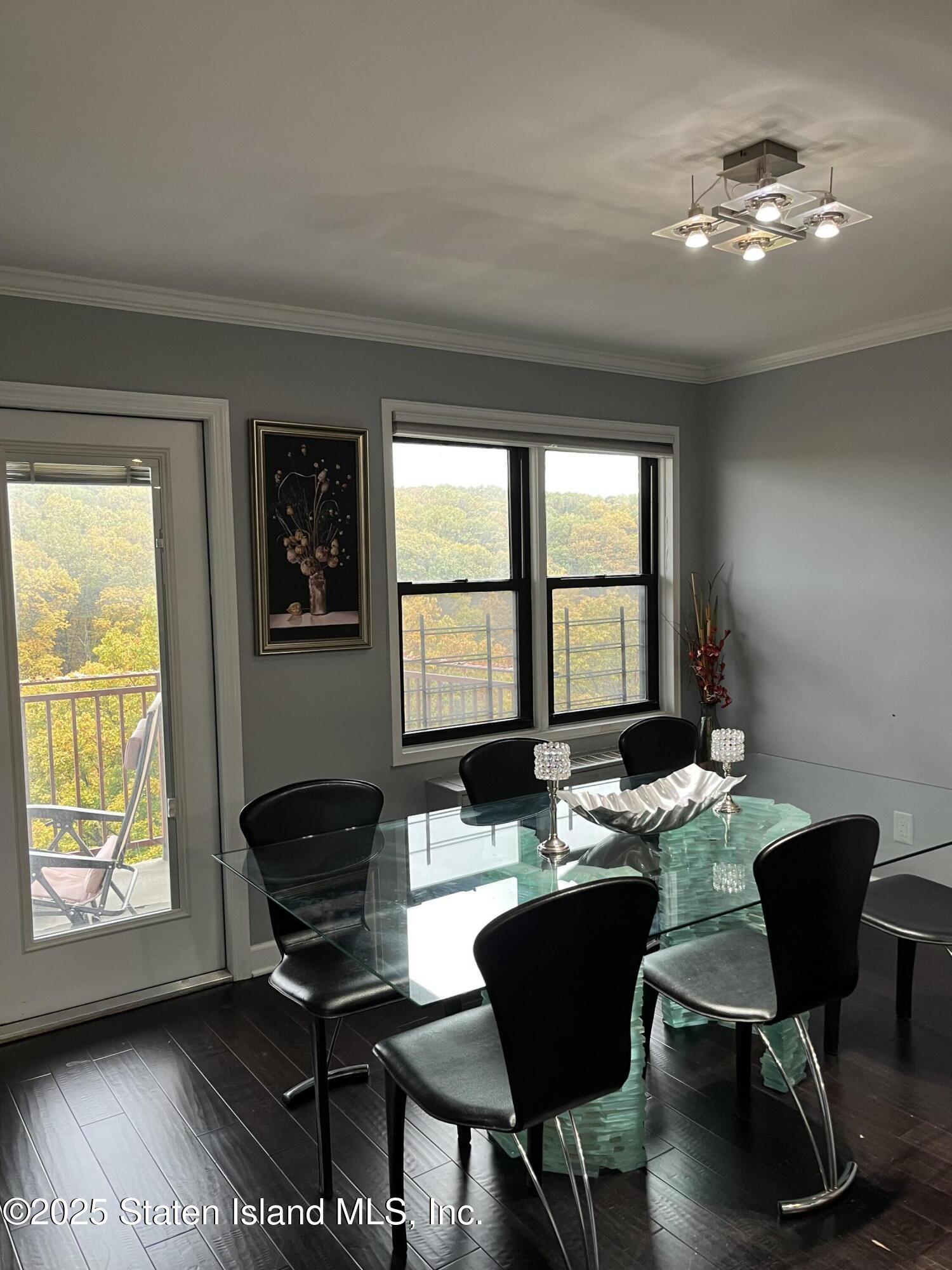 1000 Clove Road, Unit 6O & 6P Staten Island, NY 10301 - Photo 10 of 45 a living room with furniture and a large window