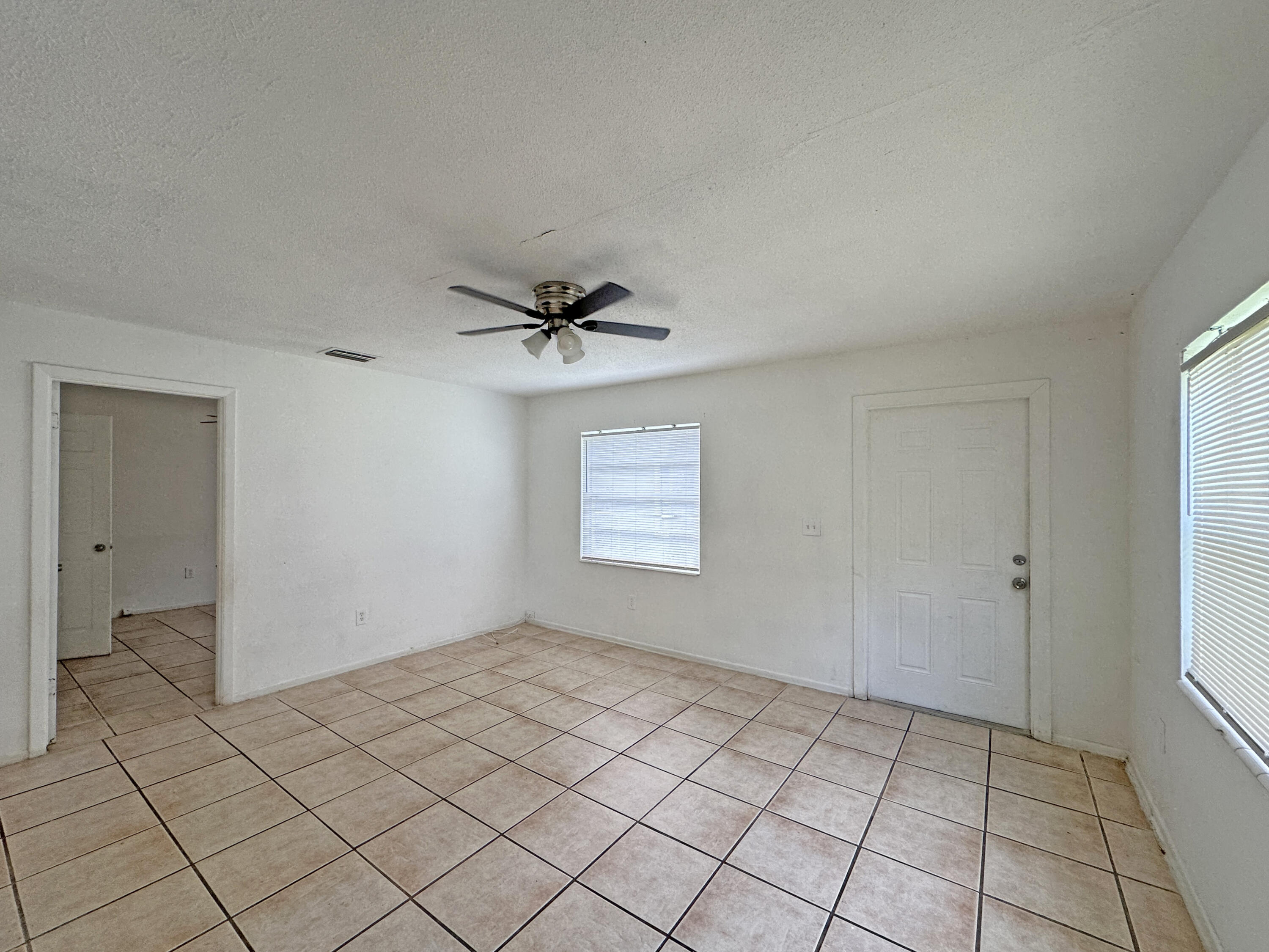 1107 North 21st Street, Unit A & B Fort Pierce, FL 34950 - Photo 16 of 24 a view of an empty room and window
