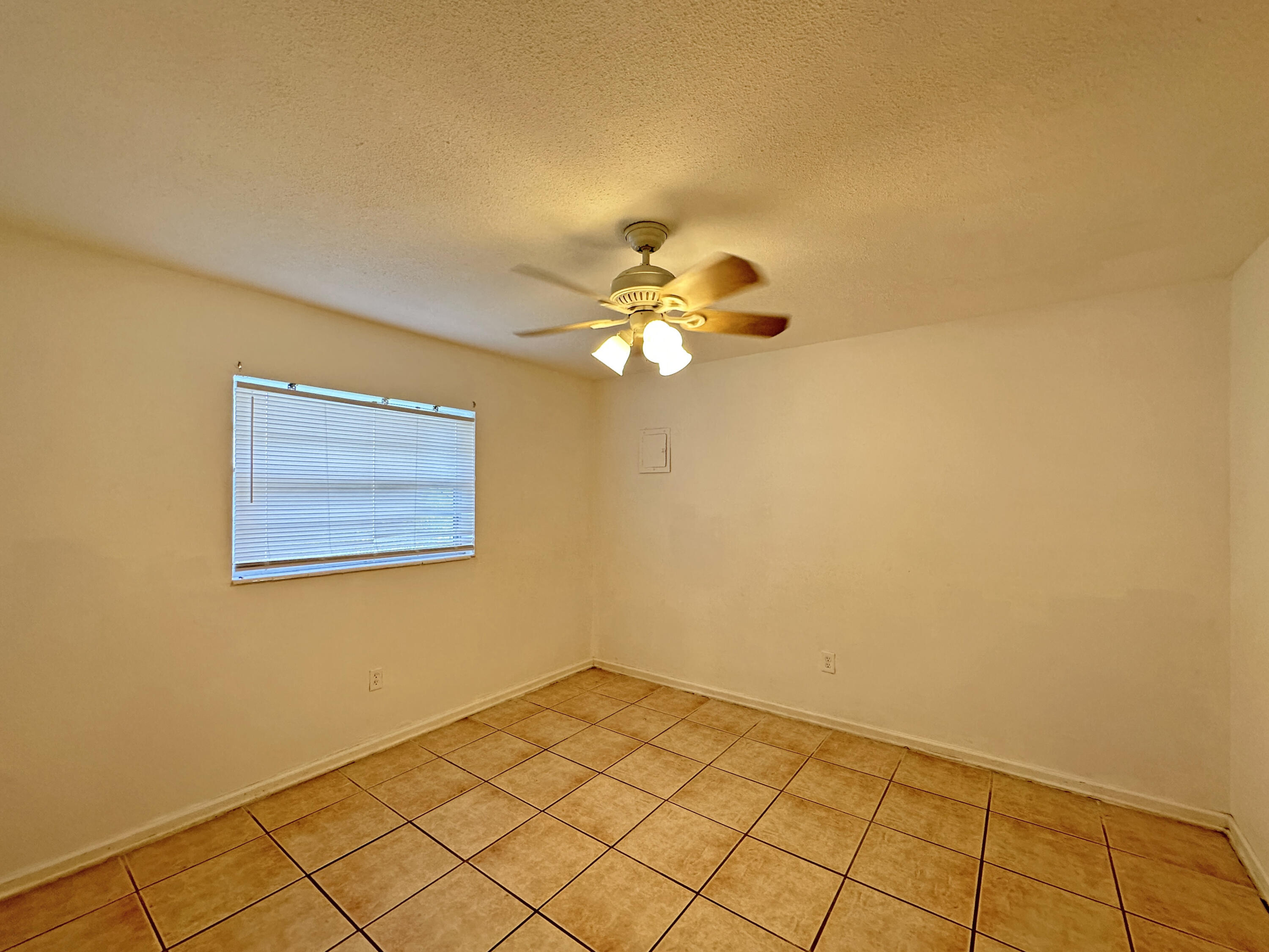 1107 North 21st Street, Unit A & B Fort Pierce, FL 34950 - Photo 20 of 24 a view of a room with a fan and cabinets