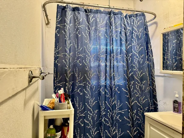 a utility room with a door and painting on the wall