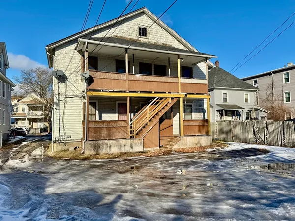 a view of a building with a yard