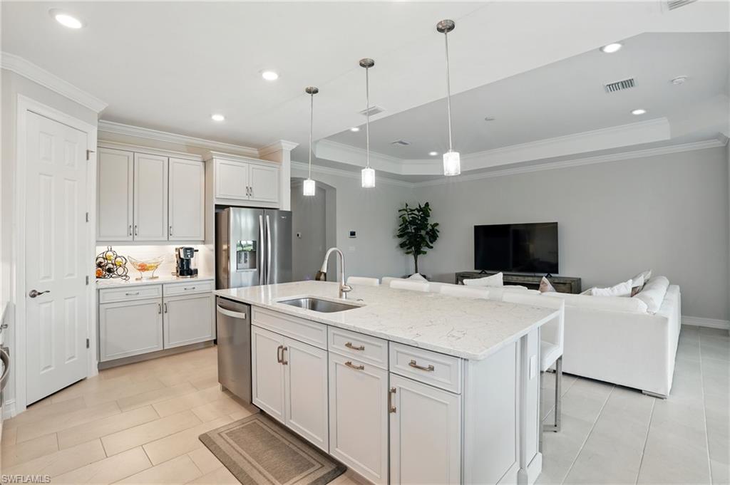 28165 Captiva Shell Loop Bonita Springs, FL 34135 - Photo 38 of 38 a kitchen with a sink and white cabinets