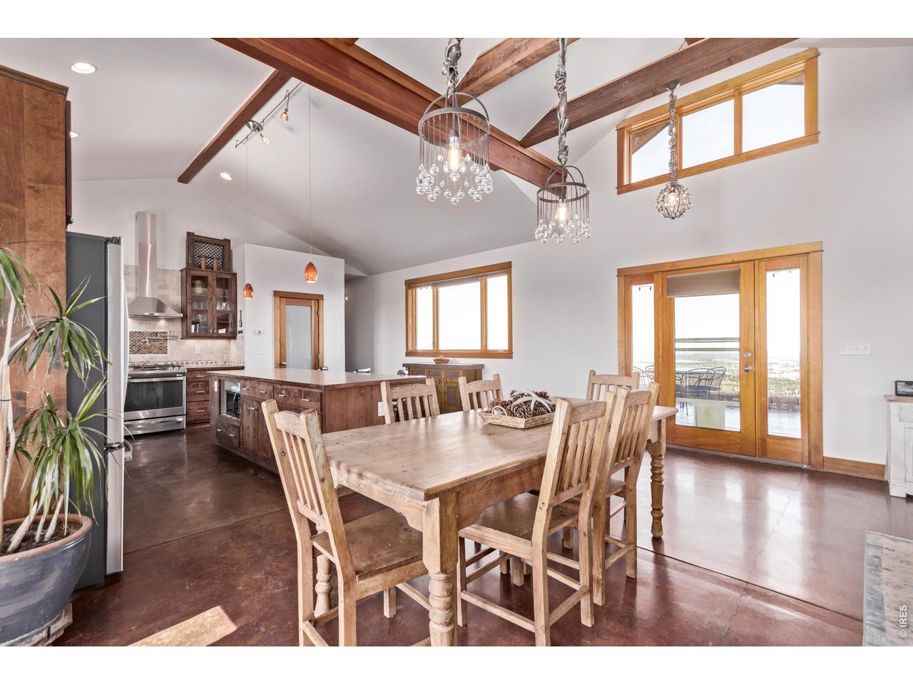 399 Northview Road Berthoud, CO 80513 - Photo 13 of 39 a view of a dining room with furniture window and wooden floor