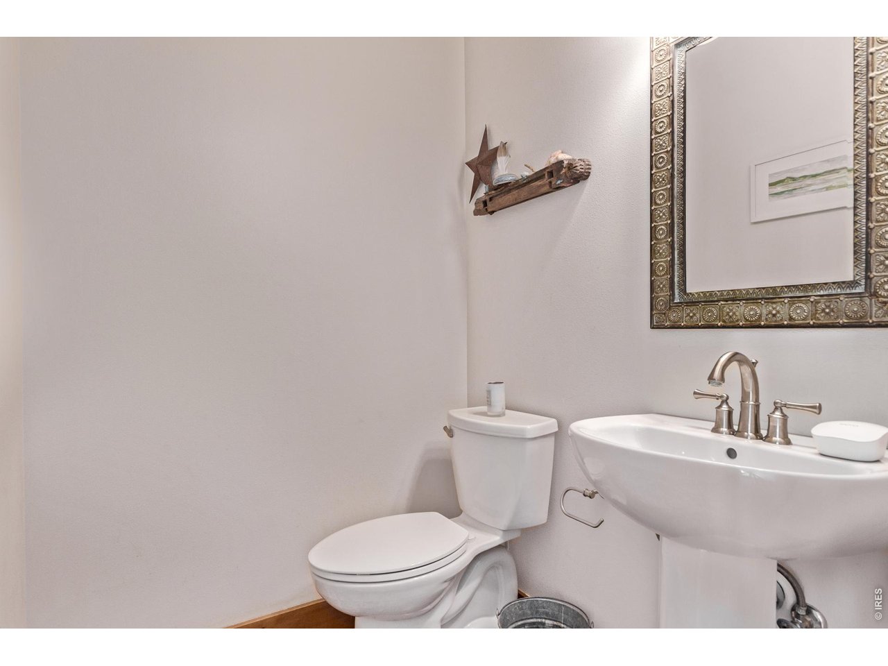 399 Northview Road Berthoud, CO 80513 - Photo 14 of 39 a bathroom with a sink toilet and a mirror