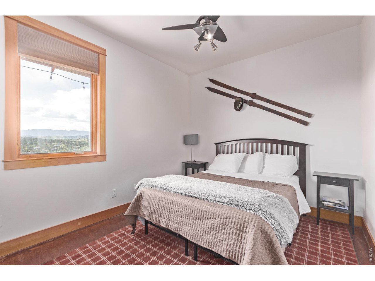 399 Northview Road Berthoud, CO 80513 - Photo 25 of 39 a bedroom with a bed and a window